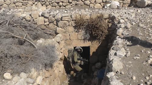 Israeli soldier searching a house in Jinba, photo by B'tselem