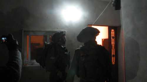 Soldiers entering in Palestinian houses, looking for 