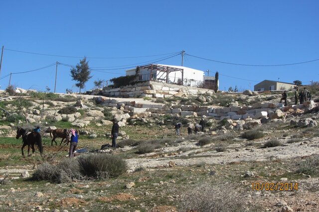 Palestinian works close to the outpost