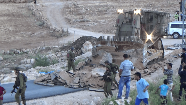 Israeli army demolishes road in Ar Rifa' Iyya