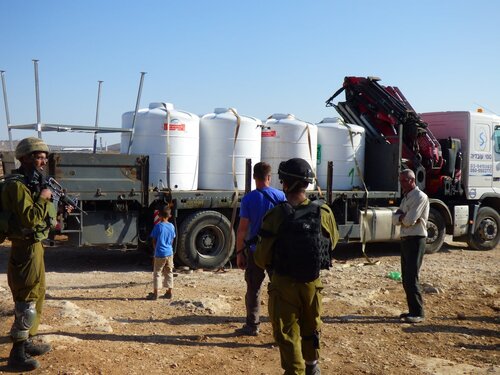 Israeli forces seize tractor and new water tanks in the Palestinian village of Susiya, South Hebron Hills.